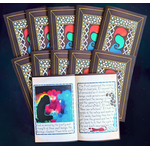 10 copies of volume 1 of "Irredeemed". The first two rows show 9 of the copies closed so the covers are visible. The last copy is open to a page spread. One of the figures on the left-hand page's illustration is covered with black acrylic paint.