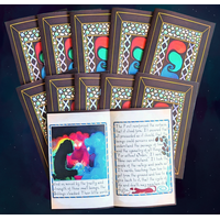 10 copies of volume 1 of "Irredeemed". The first two rows show 9 of the copies closed so the covers are visible. The last copy is open to a page spread. One of the figures on the left-hand page's illustration is covered with black acrylic paint.