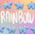 Alternating stegosaurus charms arranged in two rows along the top and bottom of the image. All of the charms are pastel blue with rainbow-colored back plates, but two have white eyes and the other two have pastel purple eyes. "Rainbow" is handwritten in white in the middle of the image between the two rows. The background is an unevenly faded white grid overlaying a pastel rainbow gradient.