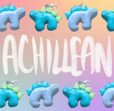 Two stegosaurus charms placed in an alternating pattern in two rows across the top and bottom of the image, against a pastel rainbow gridded background. One charm is light blue with teal back plates. The other is teal with light green plates. The word "Achillean" is written in white between the two rows.