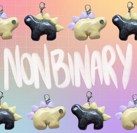 Two stegosaurus charms in an alternating pattern in two rows along the top and bottom of the image. One charm is pastel yellow with pastel purple back plates and black eyes. The other is black with yellow plates and purple eyes. "Nonbinary" is handwritten in the middle of the image between the two rows. The background is an unevenly translucent white grid overlaying a pastel rainbow gradient.