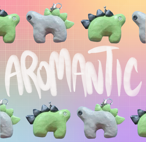 Alternating stegosaurus charms against a pastel rainbow gridded background. One is light green with black back plates and grey eyes. The other is light grey with light green plates and black eyes. They line the word "Aromantic", written in white, on the top and bottom of the image.