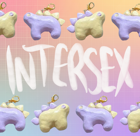 Two stegosaurus charms placed in an alternating pattern across two rows on the top and bottom of the image. One charm is pastel purple with pastel yellow back plates. The other is pastel yellow with pastel purple plates. "Intersex" is handwritten in white in the middle of the image between the two rows. The background is an unevenly faded white grid overlaying a pastel rainbow gradient.