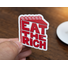 Sticker with red, stylized text in the shape of a slice of cake on a white background which reads Eat The Rich