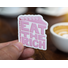 Sticker with pink stylized text in the shape of a slice of cake on a white background which reads Eat The Rich